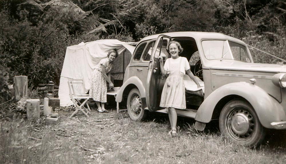 Camping-grayscale-photo-of-girl-beside-car-at-campsite