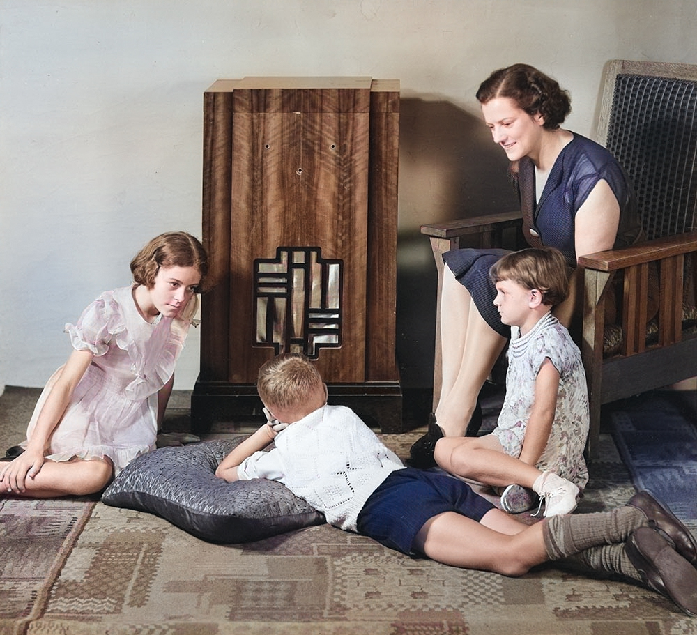 Old-Time-Radio-mother-with-girl-and-two-boys-listening-to-vintage-radio-color.