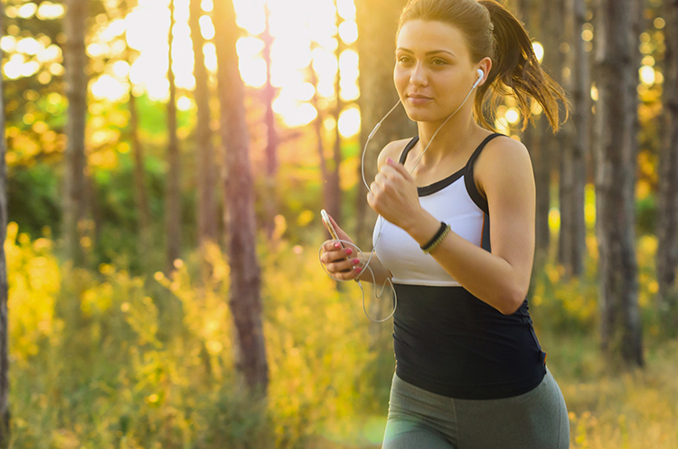 Rumble-Health-and-Fitness-Video-Ideas-woman-jogging-running-exercise-earbuds-outside.